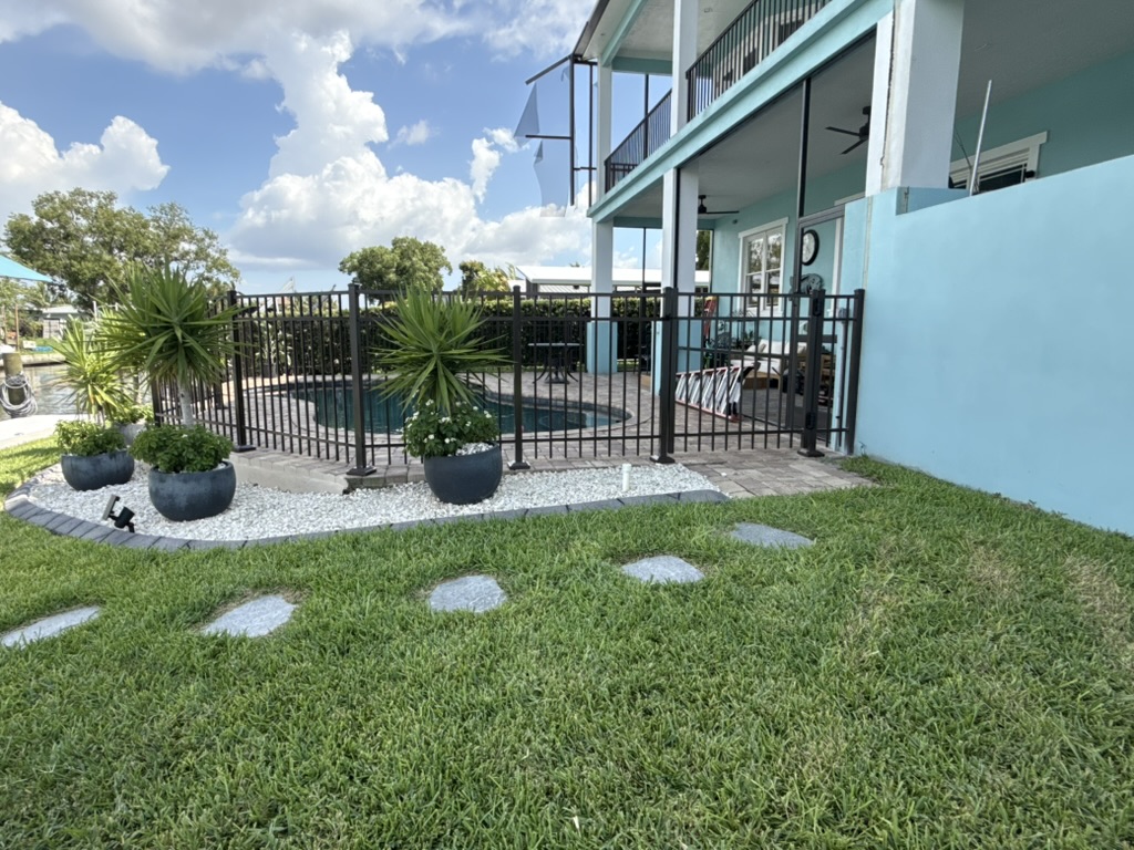 Black aluminum pool fence installed by RMH Fence